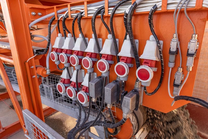 electrical-connectors-and-wiring-on-orange-machine-2026-03-19-21-52-15-utc