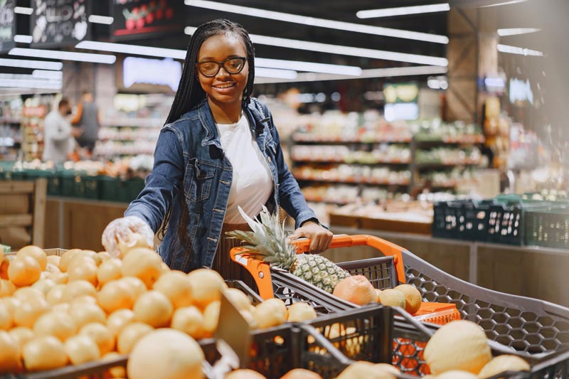Woman shopping vegetables at the supermarket